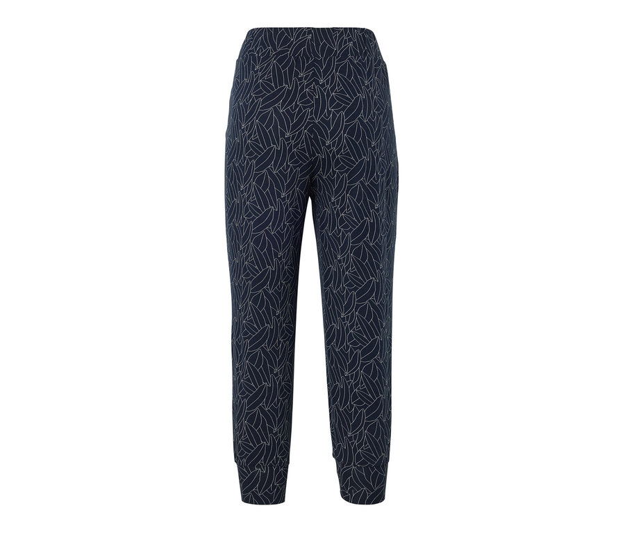 Un pantalon 3/4 en jersey bleu et blanc crème avec un motif de feuilles sur l'ensemble.