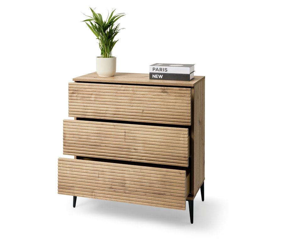 Commode avec trois tiroirs et une plante en pot.