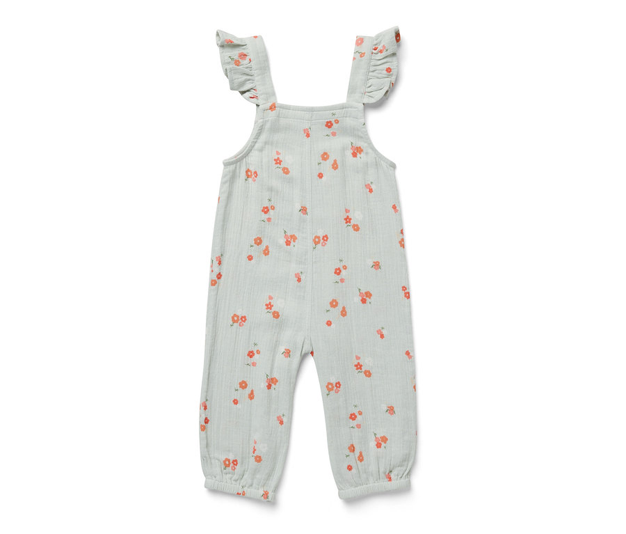 Barboteuse en mousseline vert clair avec des fleurs orange.