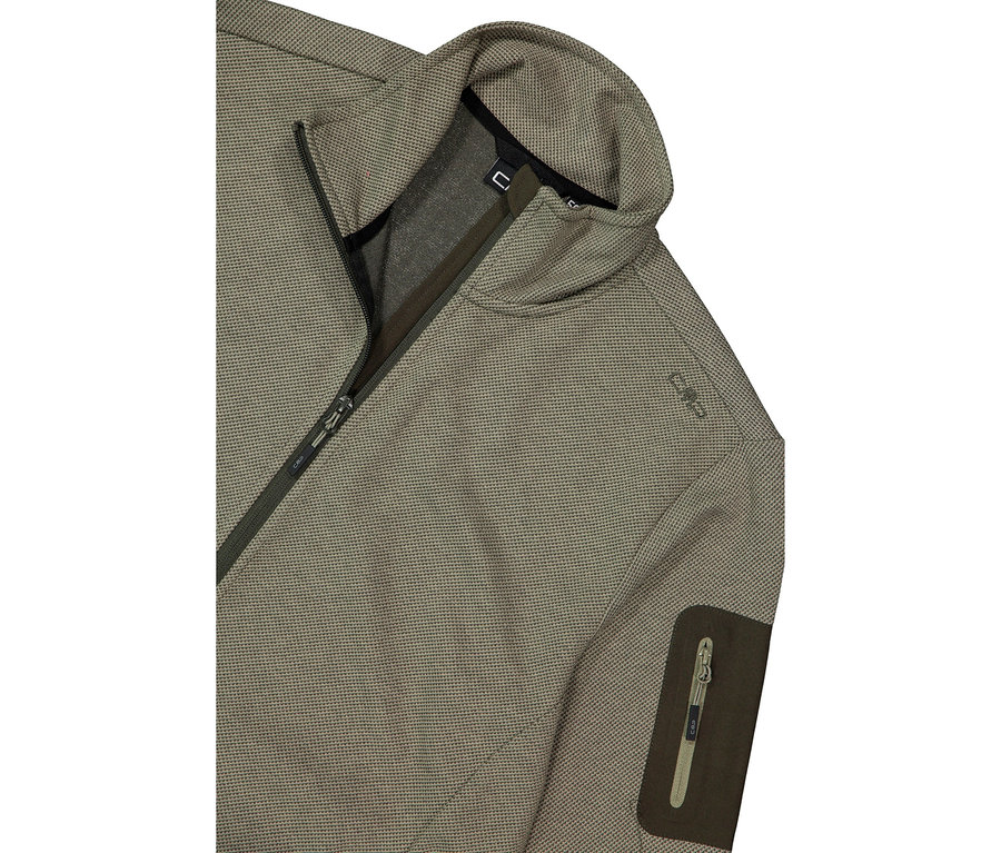 Gros plan d'une veste vert olive avec fermeture éclair et poche.