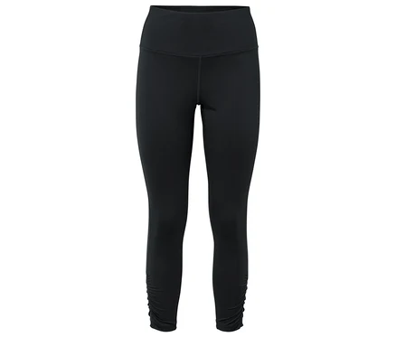 Leggings noirs avec détail froncé à l'ourlet.