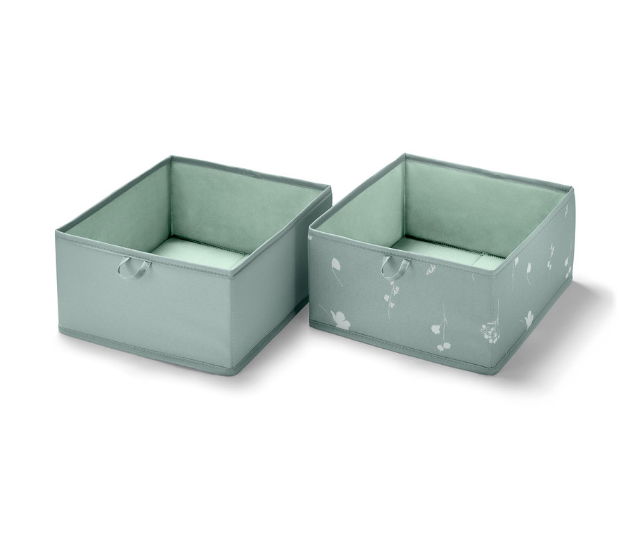Deux grandes boîtes de rangement pour tiroir, une bleu clair et une avec un motif floral blanc.