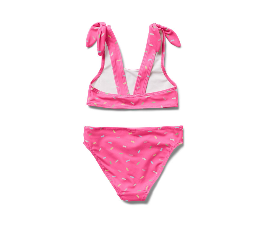 Bikini pour enfants rose avec des motifs de sprinkles colorés.