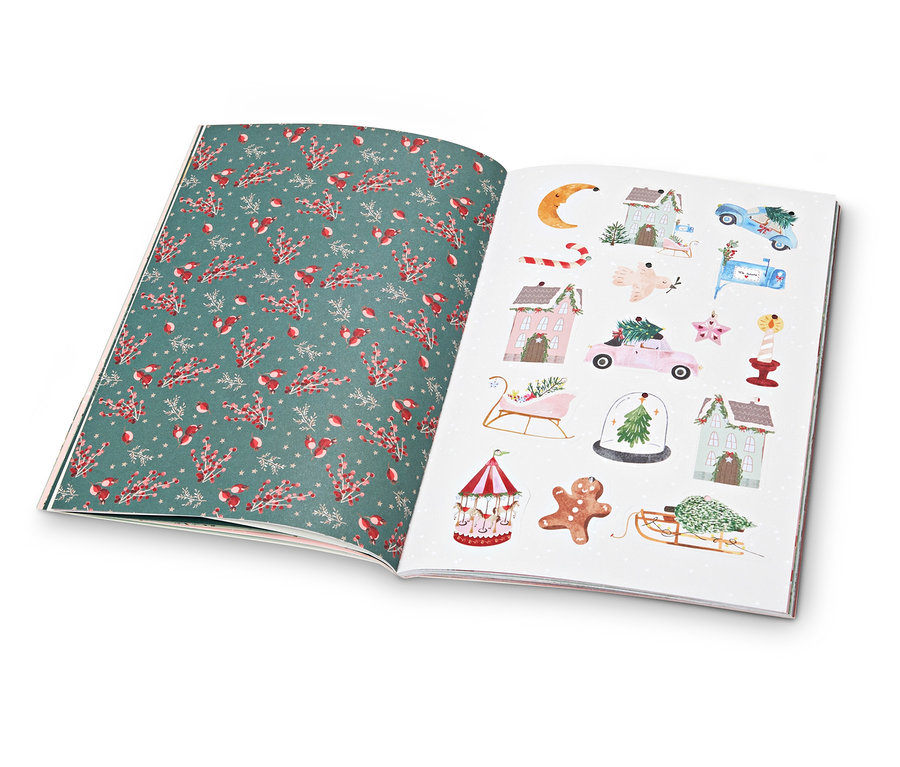 Livre ouvert avec des pages d'illustrations de Noël.