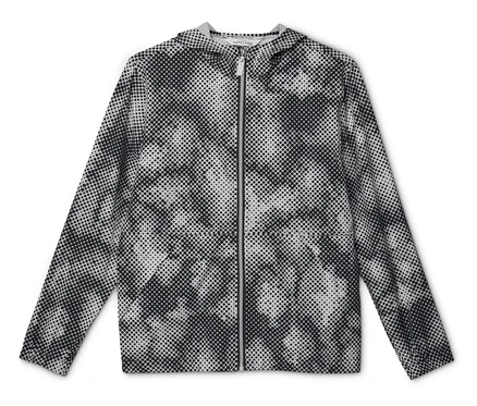 Veste coupe-vent pour enfant à capuche avec motif à pois noir et blanc, posée à plat.
