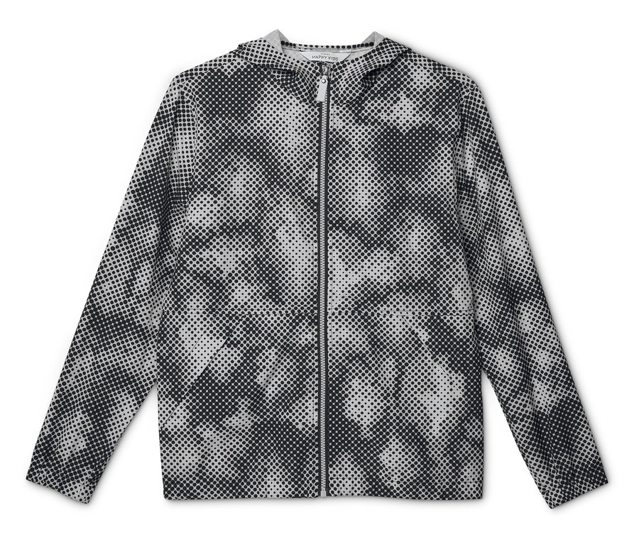 Veste coupe-vent pour enfant à capuche avec motif à pois noir et blanc, posée à plat.