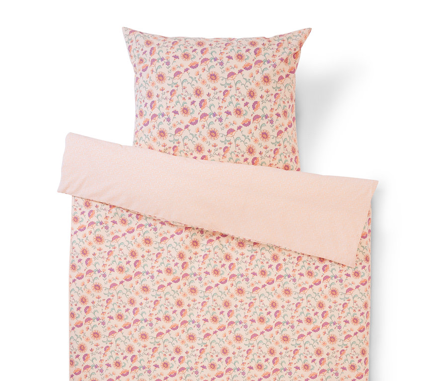 Ensemble de literie à motif floral rose, violet et vert, comprenant une taie d'oreiller et une housse de couette.
