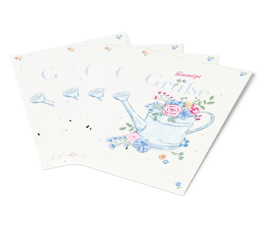 Trois feuilles de papier avec un dessin d'un arrosoir avec des fleurs.