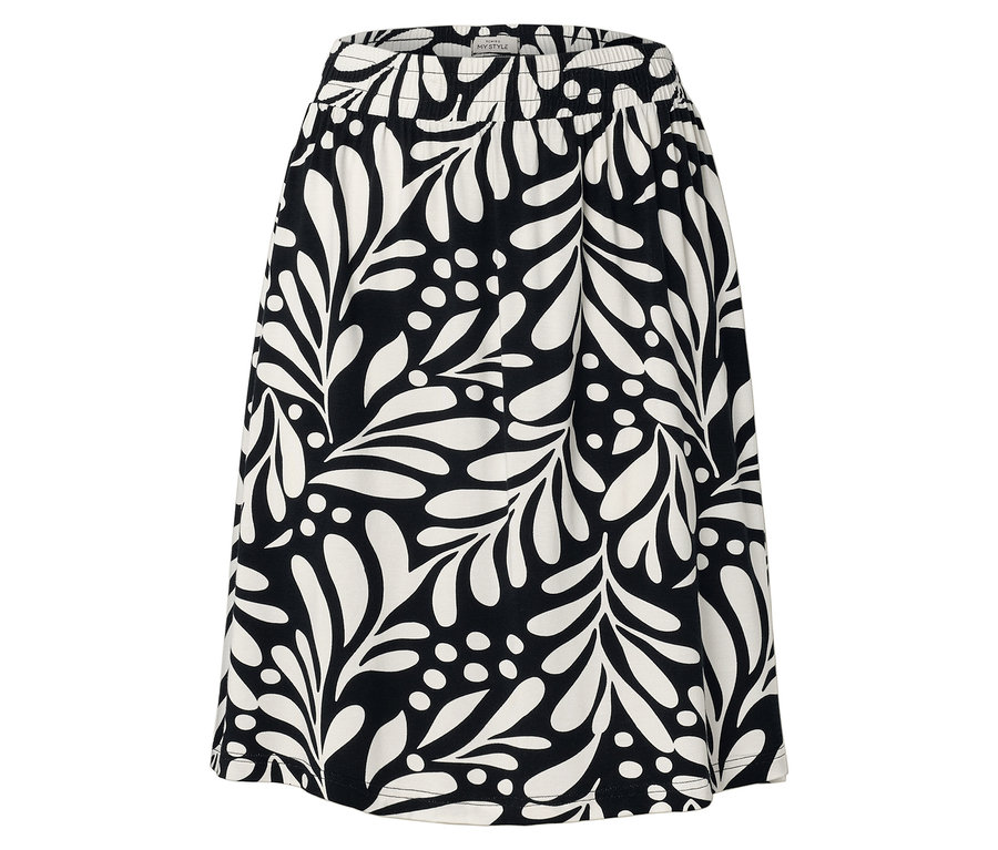 Gros plan d'une jupe avec une taille élastique et un motif floral noir et blanc.