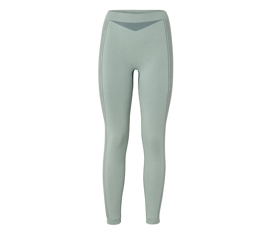 Legging sans couture vert clair avec des détails à motifs plus foncés sur la taille et les cuisses extérieures.