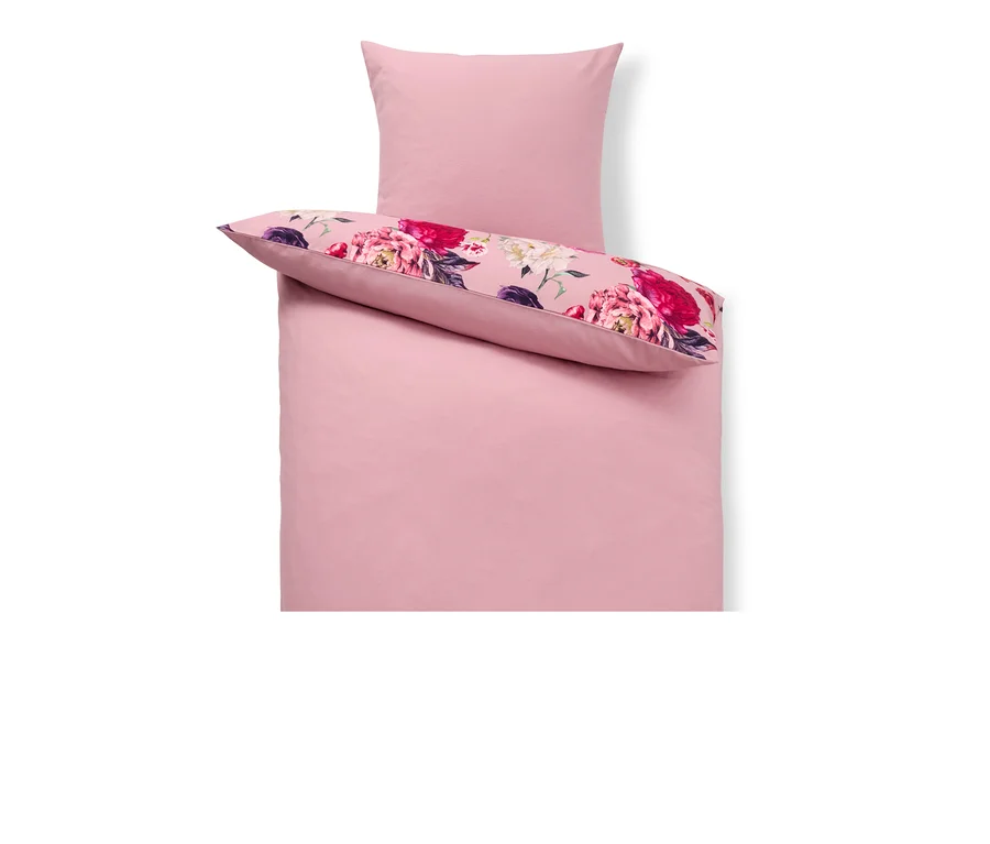 Parure de lit en molleton rose, taille standard, avec motif floral sur l'oreiller.