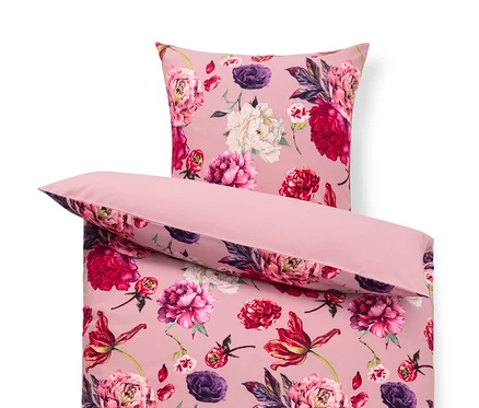 Gros plan d'une parure de lit en flanelle rose à motif floral.