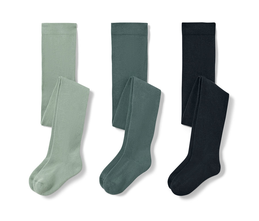 Trois collants pour enfant : vert clair, vert foncé et bleu.