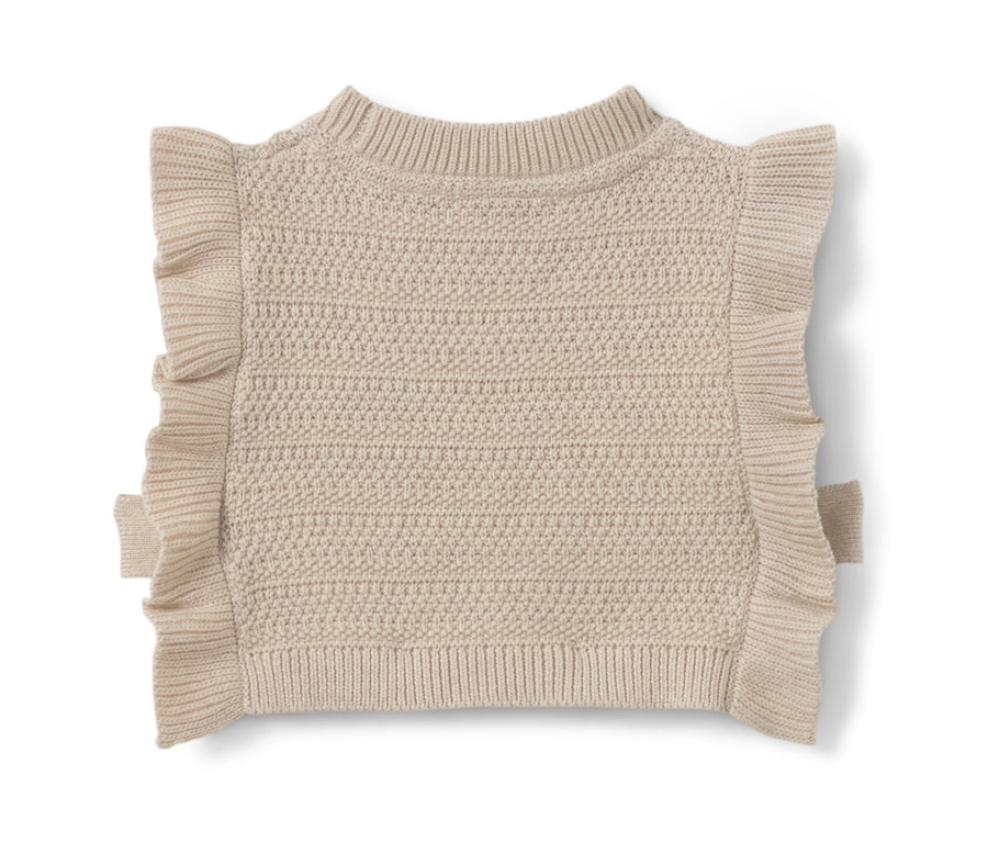 Pull sans manches en maille beige pour enfant avec des volants sur les épaules.