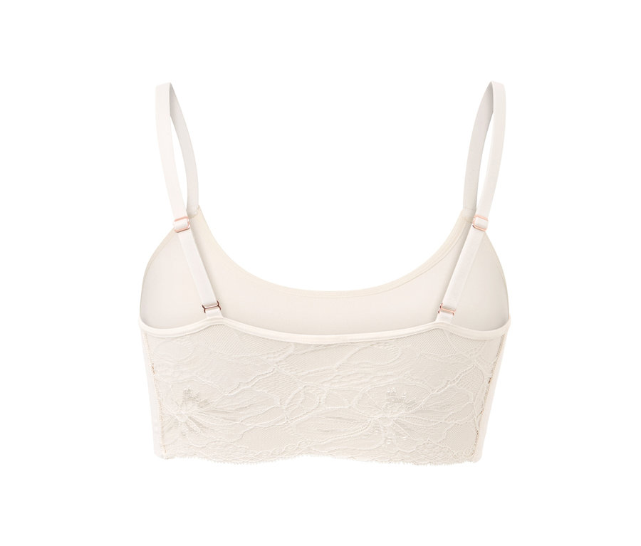Vue détaillée de dos d'une brassière seamless crème avec dentelle.