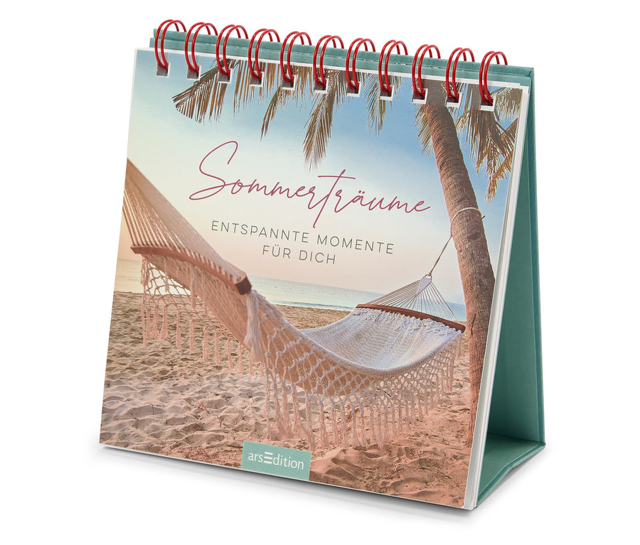 Gros plan du livre à poser « Sommerträume » (en allemand) avec un motif de plage.