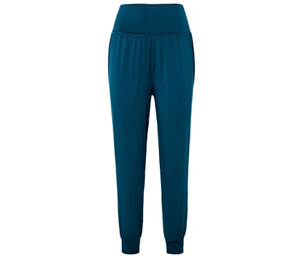 Un pantalon de jogging bleu avec une taille élastique et des poignets.