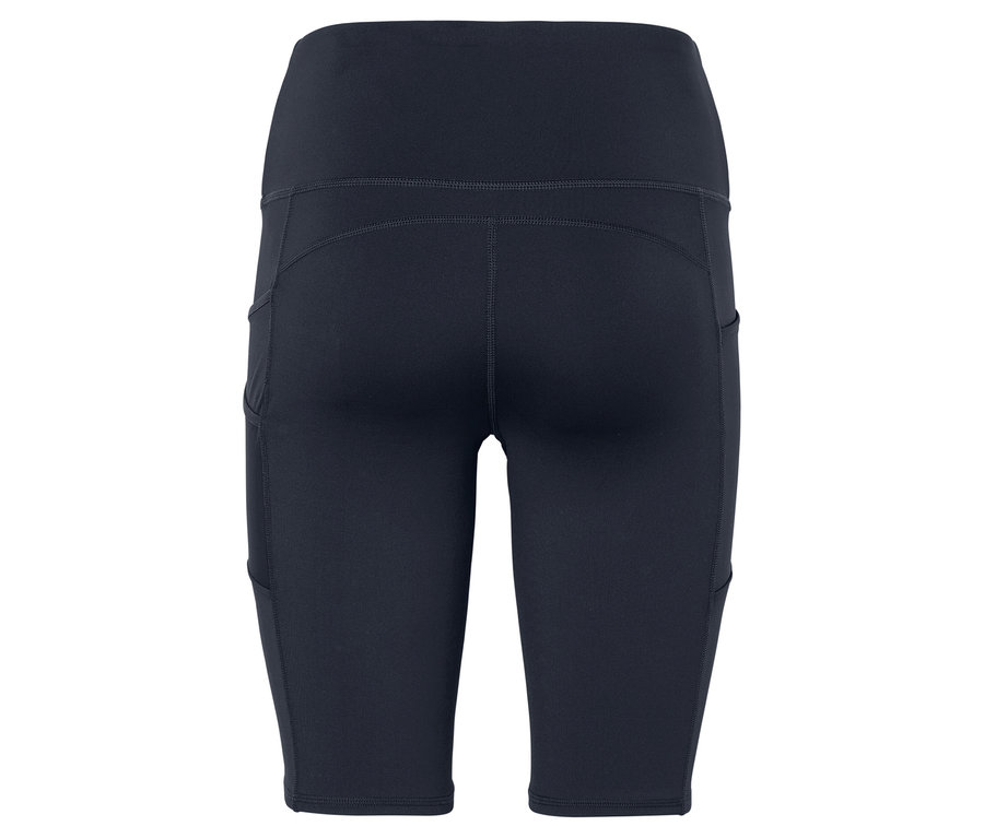 Gros plan sur l'arrière d'un cuissard de cycliste bleu marine ajusté, taille haute, avec poches latérales.