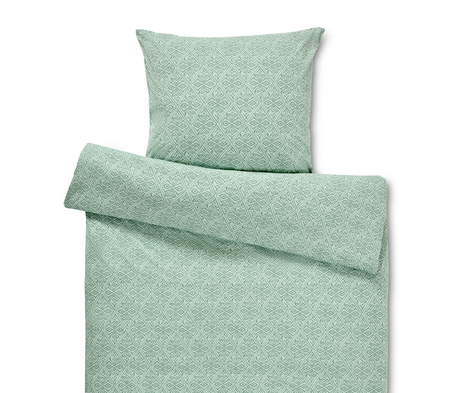 Parure de lit en jersey verte à motif géométrique. Une housse de couette taille standard et une housse de couette grande taille.