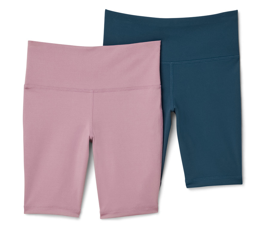 Deux shorts de sport, un rose et un bleu-vert, sont placés côte à côte.