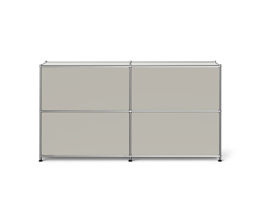 Système d'armoire modulaire gris clair avec cadre chromé, composé de quatre compartiments fermés sur deux rangées.