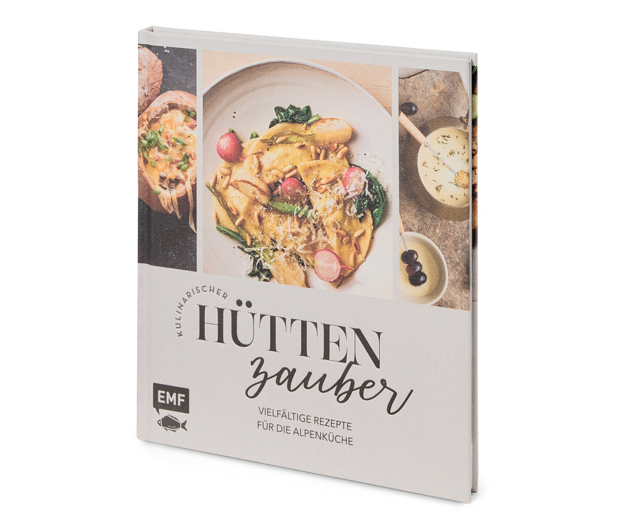 Gros plan d'un livre de cuisine intitulé Hüttenzauber avec des photos de plats.