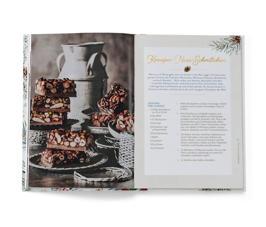 Livre ouvert avec une photo de barres de noix en couches et une recette, avec le livre « Christmas is a feeling » (en allemand).