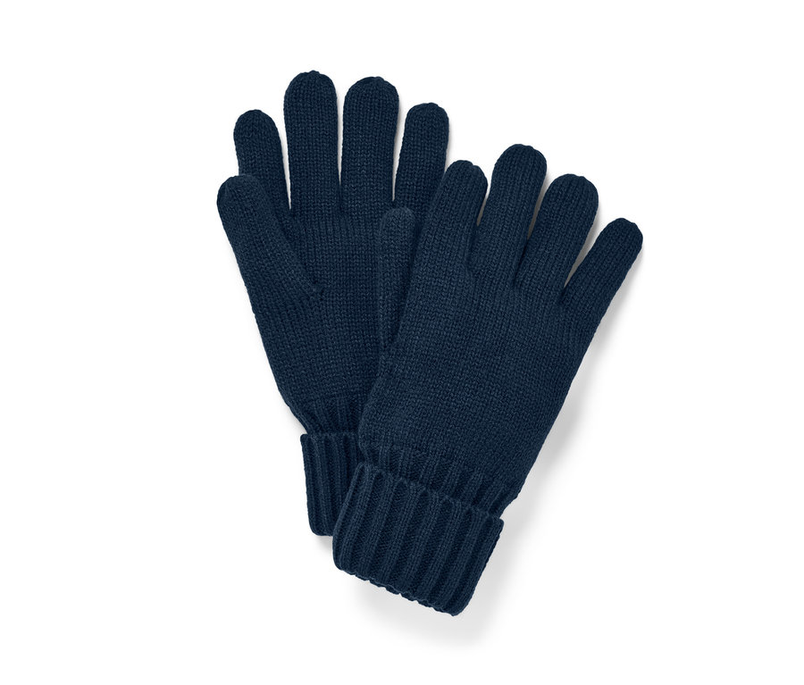 Des gants en maille bleu marine sont posés l'un à côté de l'autre.