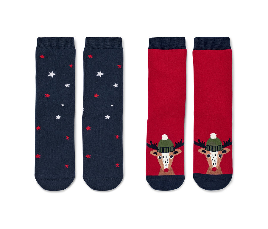 Deux paires de chaussettes antidérapantes pour tout-petit avec un motif de renne.