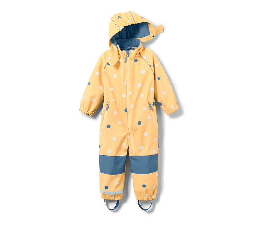Combinaison softshell jaune pour enfant avec un imprimé intégral à pois.