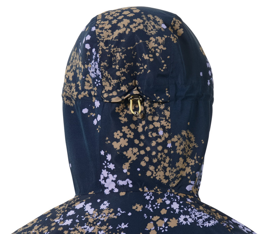 Gros plan sur la capuche d'une veste de ski à fermeture demi-zippée à motif floral.