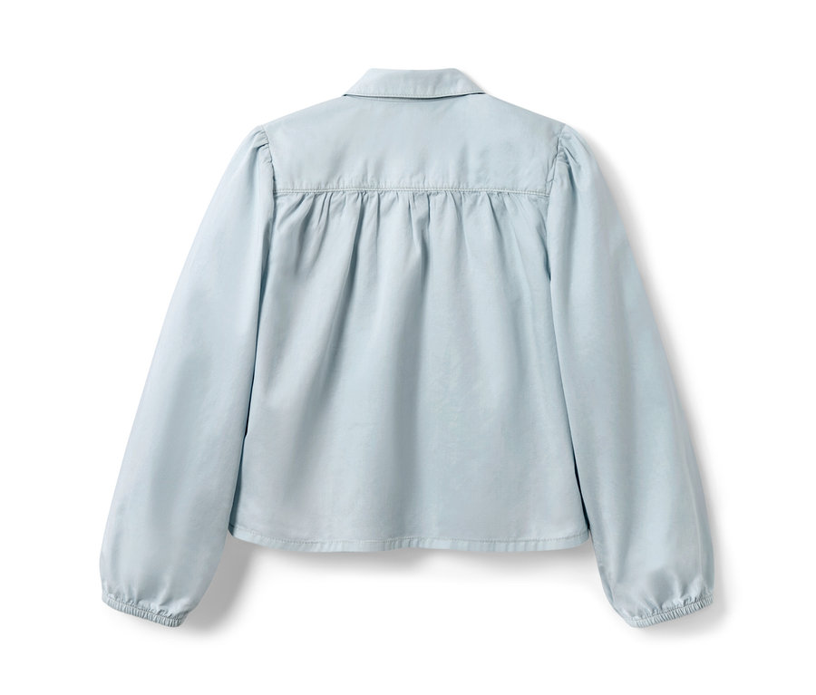 Blouse en jean bleu clair pour enfant vue de dos.