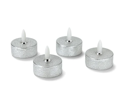 Quatre lampes à thé LED en cire argentées.