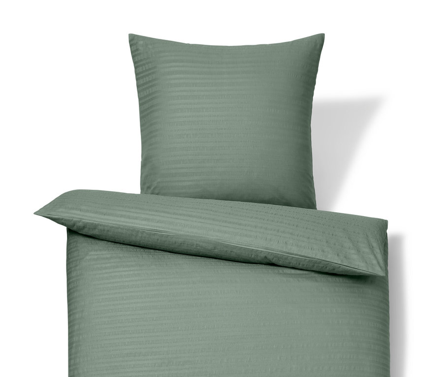 Parure de lit en seersucker verte de taille standard et grande taille sur fond blanc.