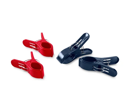 Deux pinces à linge rouges et deux bleu foncé sur fond blanc.