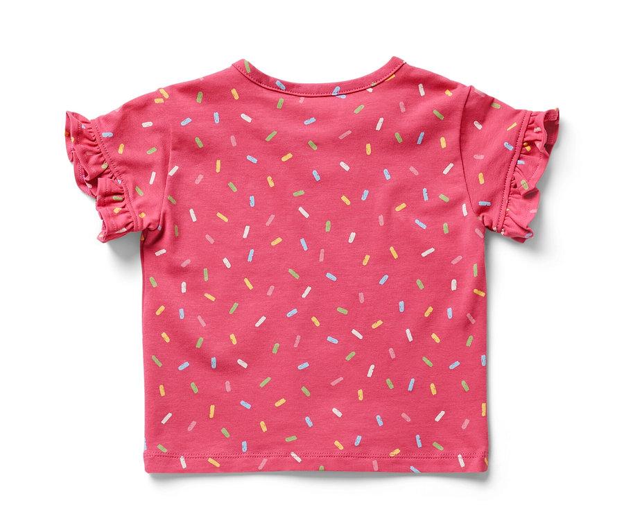 T-shirt rose pour bébé avec des manches courtes et des confettis multicolores.