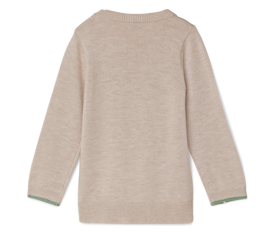 Gros plan sur un pull beige à manches longues avec une bordure verte.