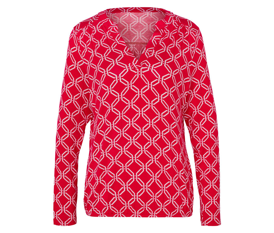 Blouse rouge à manches longues avec un motif géométrique blanc.