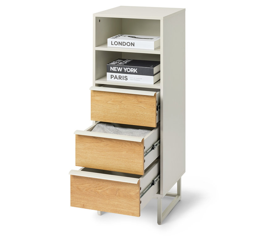 Colonne à tiroirs «
LEEG » avec 3 tiroirs, dont un tiroir est partiellement ouvert et des livres sont posés sur le dessus.