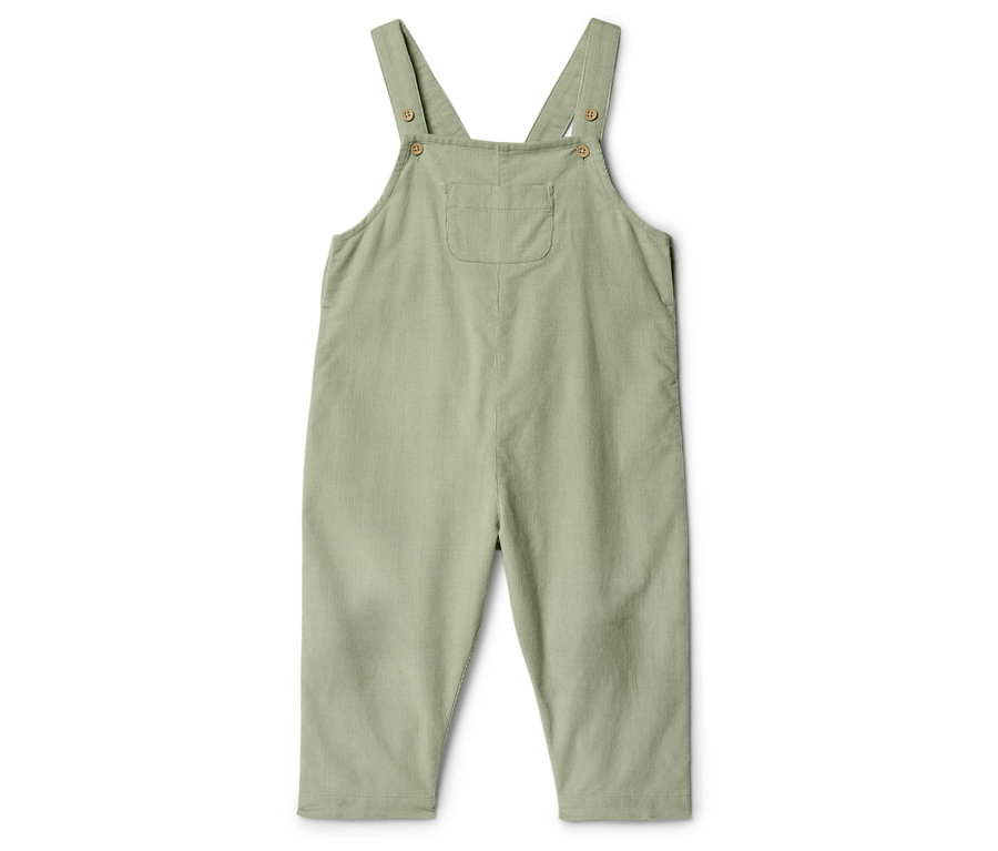 Salopette vert clair pour enfants avec poche poitrine, isolée sur fond blanc.