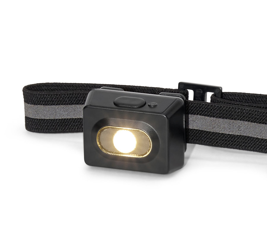 Gros plan d'une lampe frontale noire.