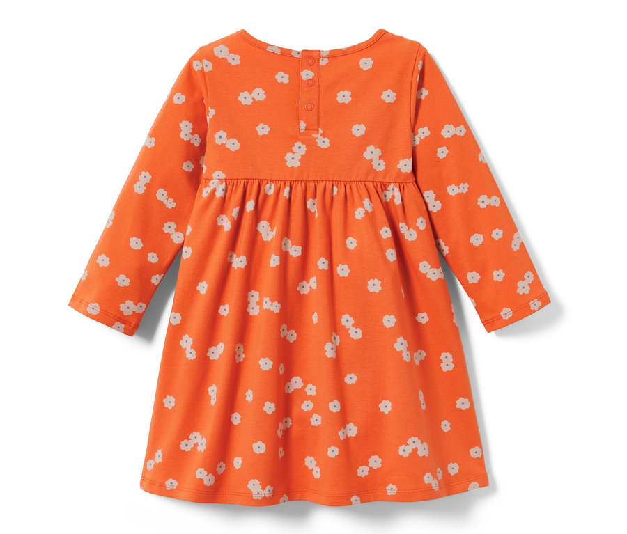 Robe en jersey orange pour tout-petit avec un motif floral.