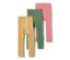 Trois leggings thermiques pour enfant : un rayé orange et blanc, un vert et un rose.