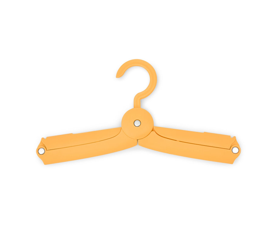Un cintre de voyage pliable jaune (6 cintres) sur fond blanc.