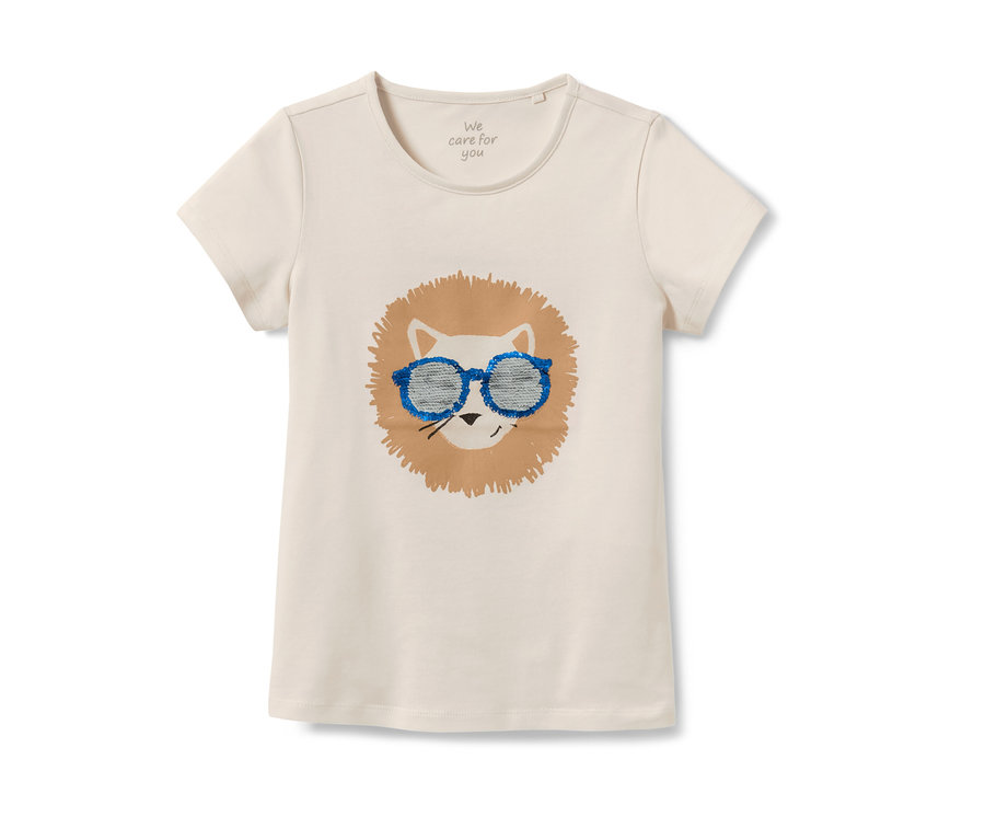 T-shirt blanc pour enfant avec un motif de lion et des lunettes à paillettes bleues.