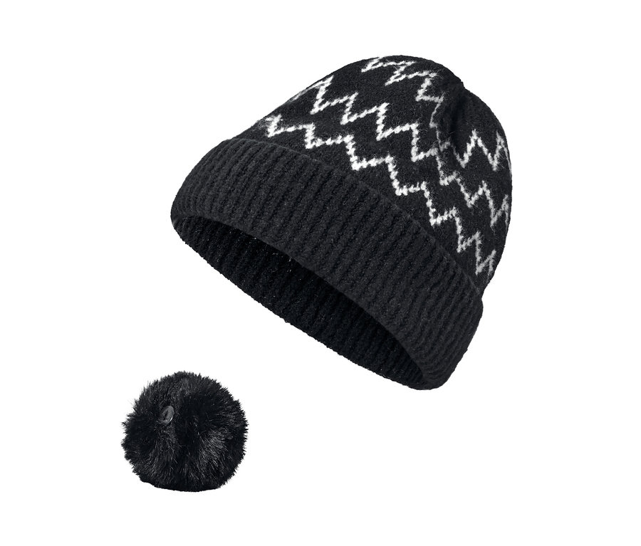 Bonnet en maille noir à motif zigzag blanc avec pompon.