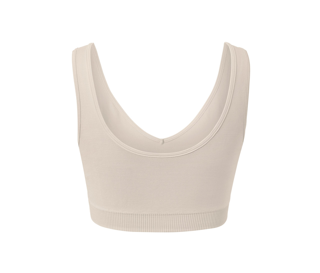 Détail d'une brassière de sport sans coutures blanc cassé.