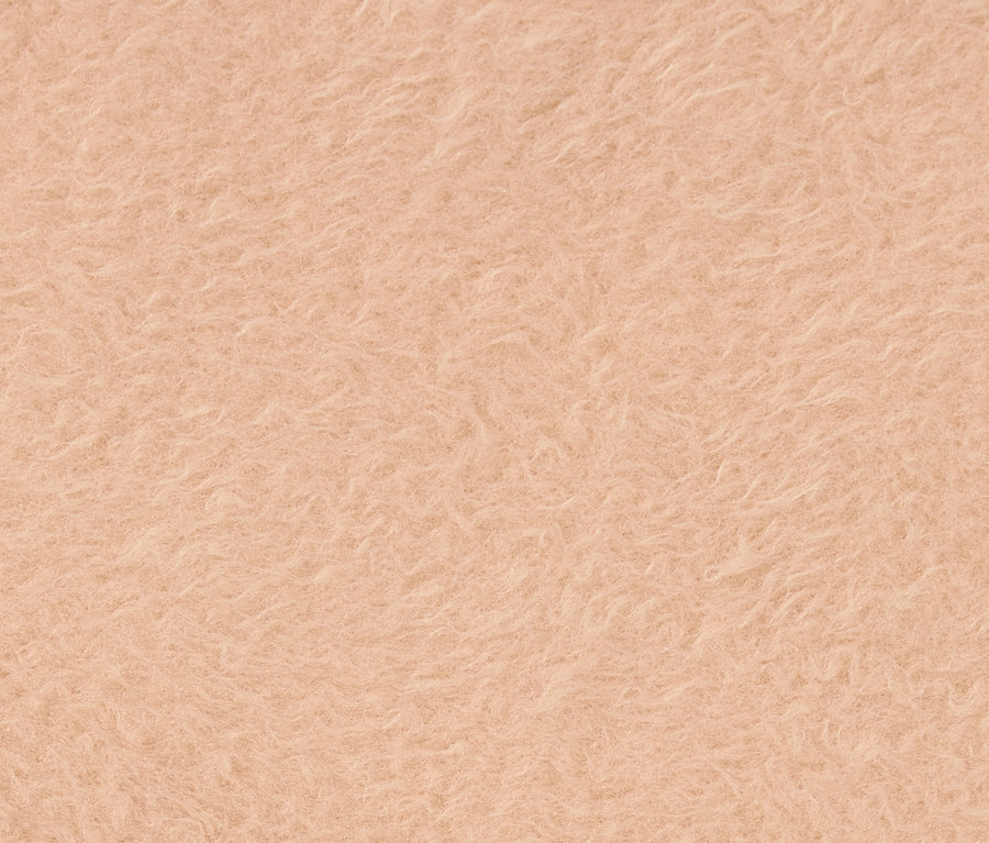 Gros plan sur la texture d'un tissu orange clair.