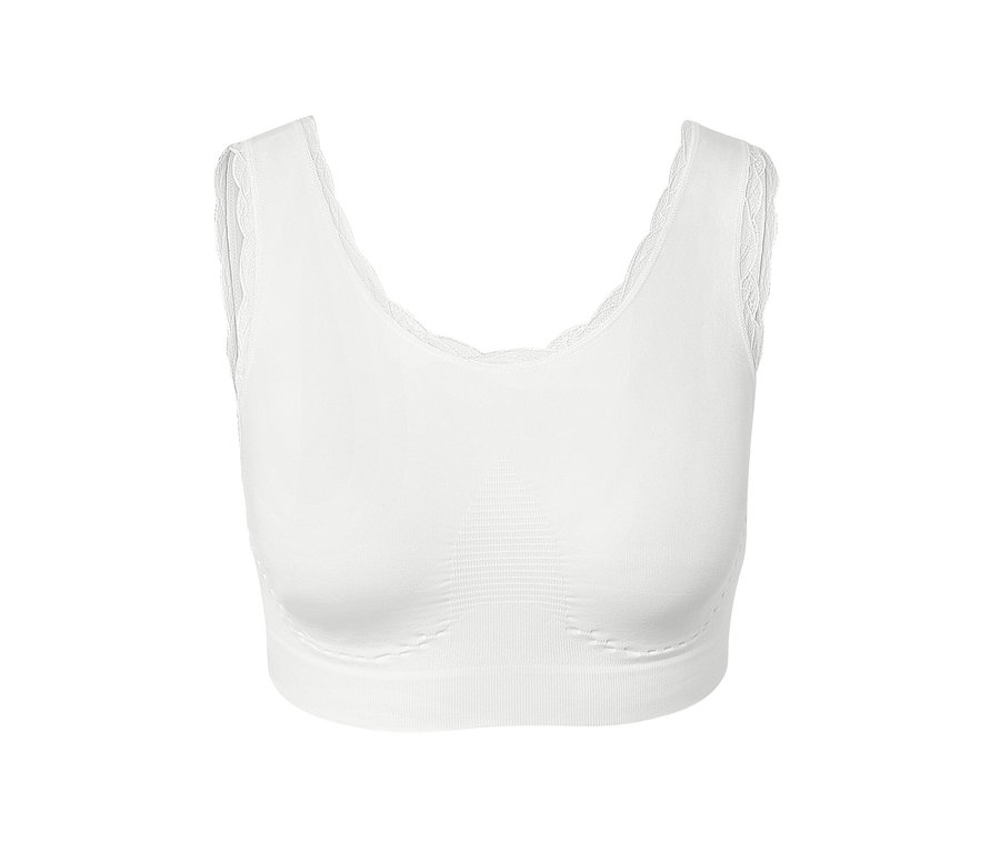 Détail d'une brassière sans coutures blanche avec de la dentelle.