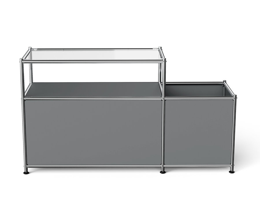 Système de rangement modulaire gris avec cadre chromé et plateau supérieur en verre.